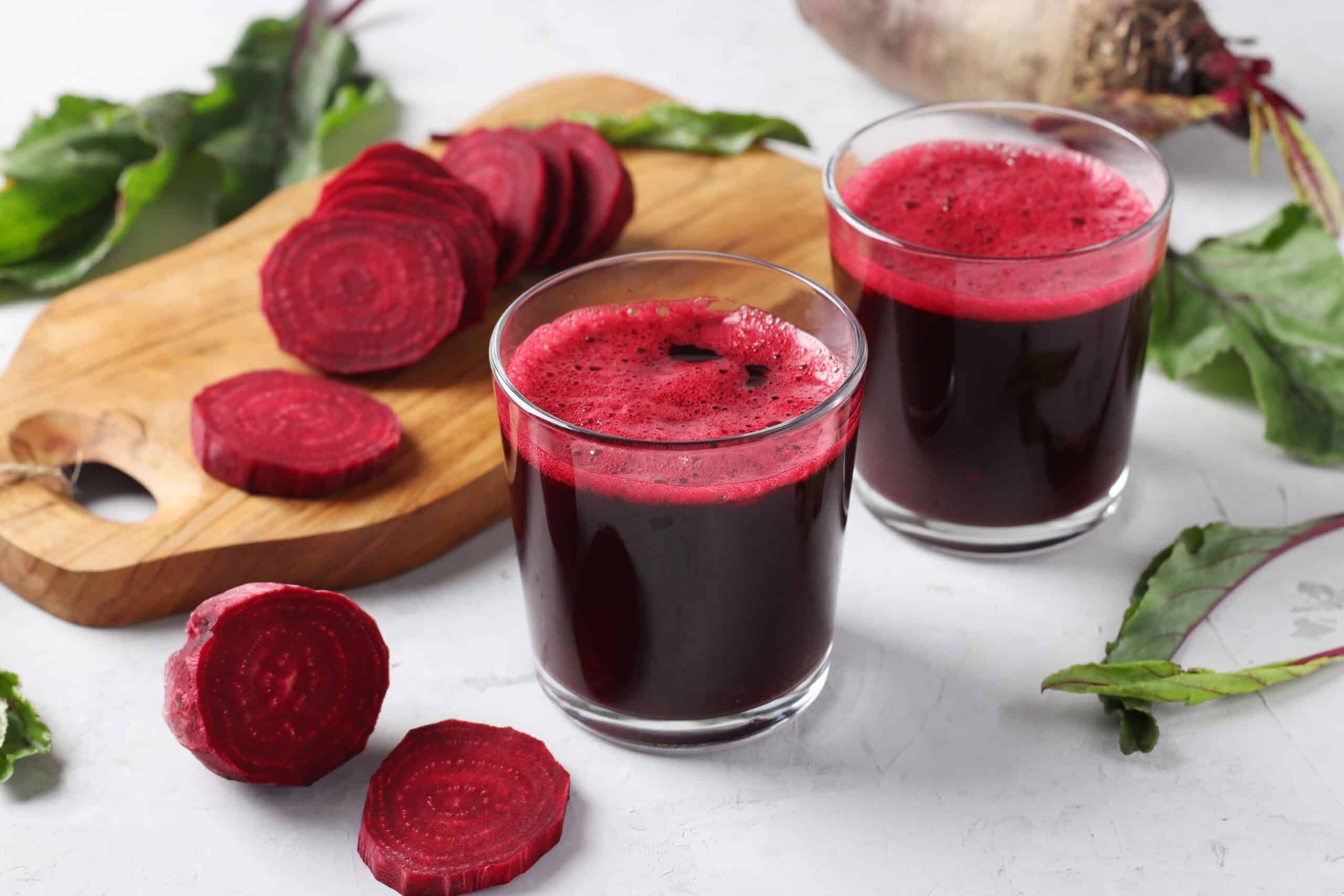 two glass of fresh beetroot juice and chopped beet royalty free image 1675798693 scaled 1