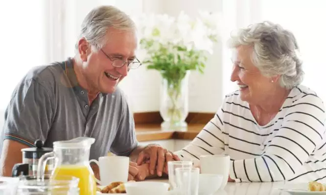 elderly senior smiling couple breakfast 666x399 1